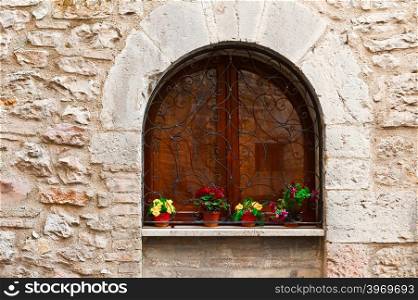 Arched Window Decorated With Fresh Flowers in Italy