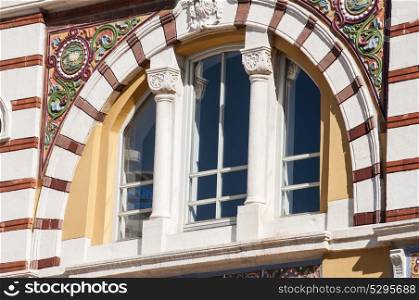 Arched window with colorful ornaments of beautiful building