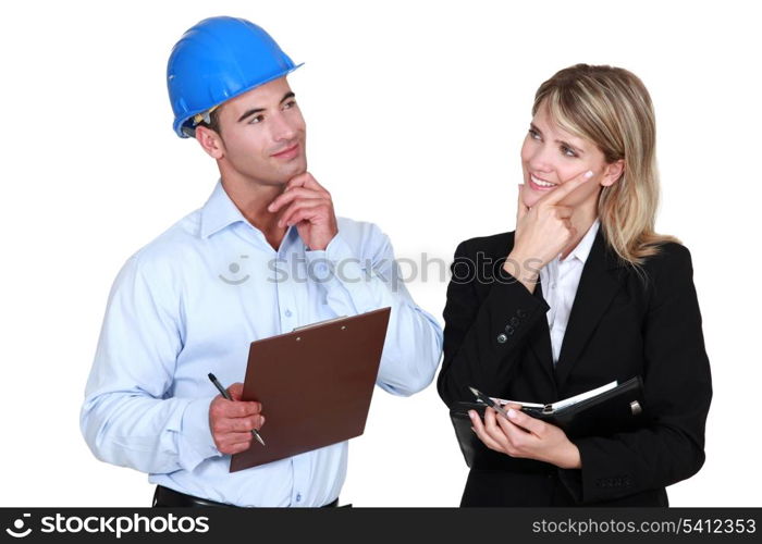 Architect and builder thinking about the same thing
