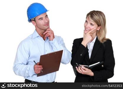 Architect and builder thinking about the same thing