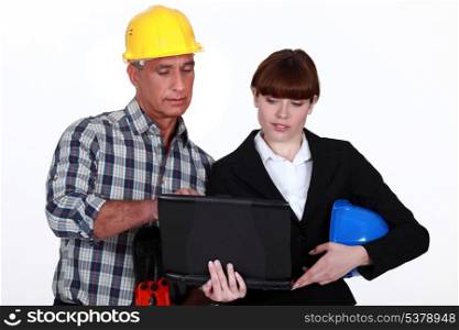 Architect and builder with a laptop