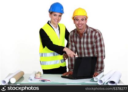 Architect and builder with laptop