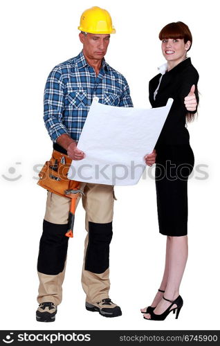 Architect and builder with plans