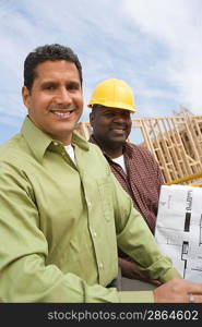 Architect and construction worker on construction site