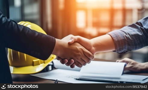 Architect and engineer construction workers shaking hands
