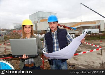 Architect and engineer on construction site
