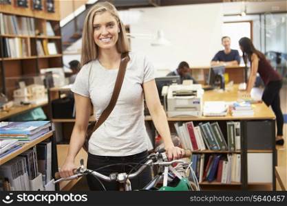 Architect Arrives At Work On Bike Pushing It Through Office