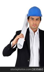 Architect carrying plans in front of white background