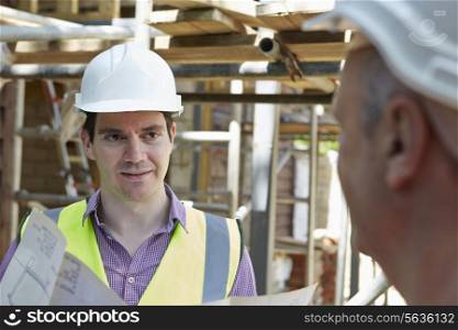 Architect Discussing Plans With Builder