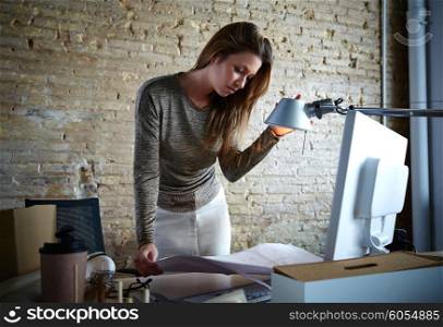 Architect engineer woman working with plan at office indoor