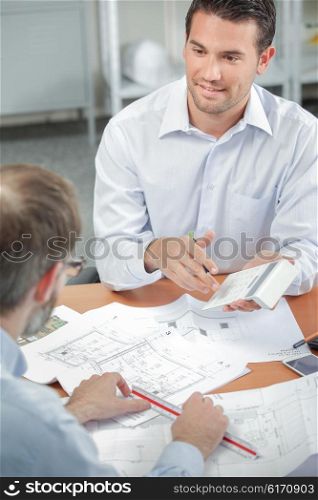 Architect explaining costs to client
