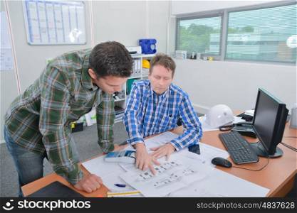 Architect explaning something to client