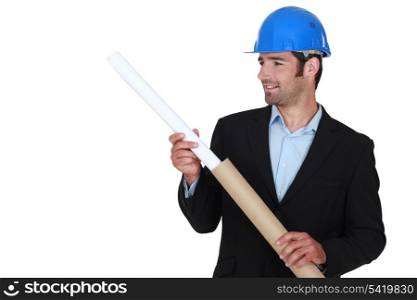 Architect fixing flat cardboard tube