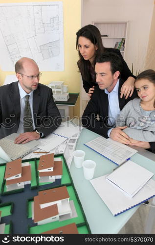 Architect having meeting with young family