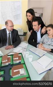 Architect having meeting with young family