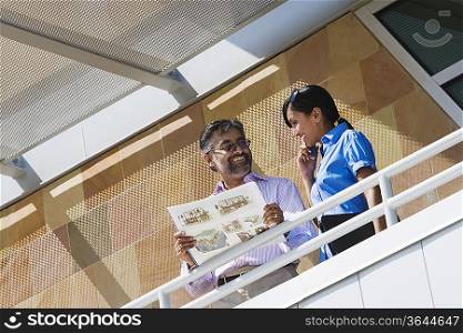 Architect Holding Book with Building Plans