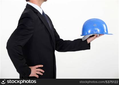 Architect holding hard hat