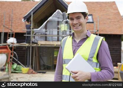 Architect On Building Site Using Digital Tablet