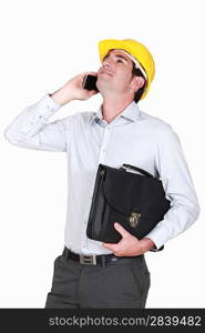 architect on the phone holding briefcase