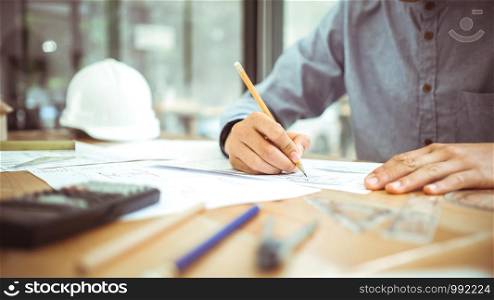 Architect or engineer working in office, Construction concept. Engineering tools.