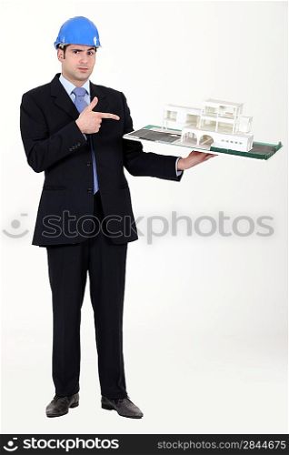 Architect pointing at his model.