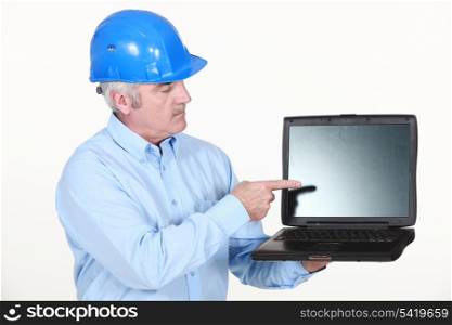 Architect pointing at laptop