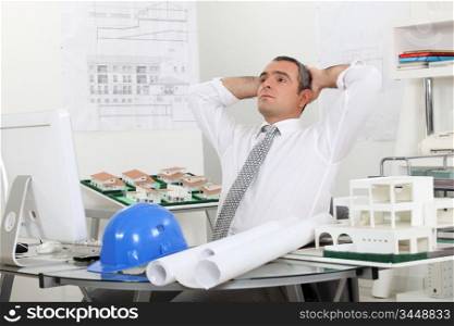 architect relaxing in his office