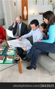 Architect sat with young family