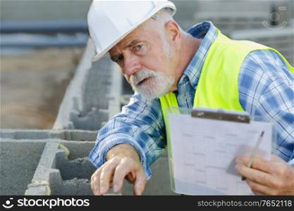 architect site manager in front of construction site