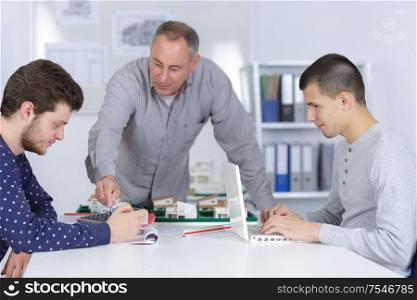 architect student working with teacher