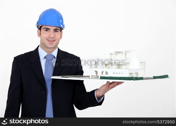 Architect with model in hand