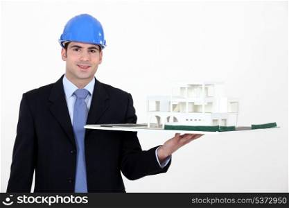 Architect with model in hand