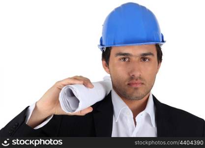 Architect with plan and hardhat