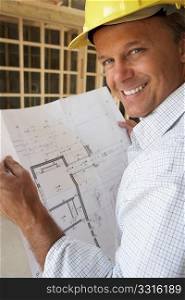 Architect With Plans In New Home
