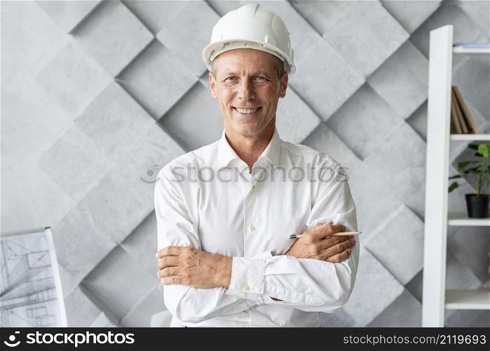 architect with safety helmet posing