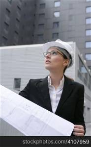 architect woman working outdoor with modern buildings