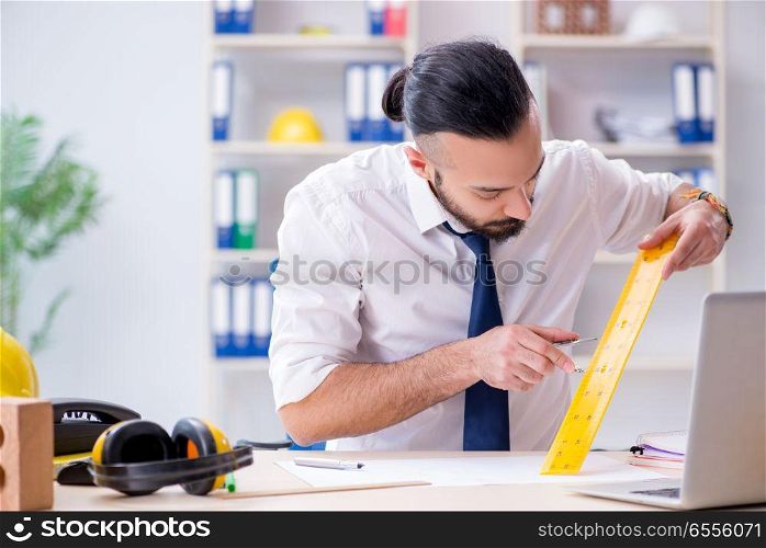 Architect working in his studio on new project