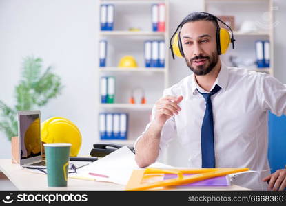 Architect working in his studio on new project