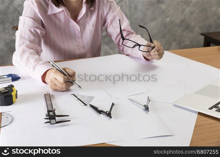 architect working on construction engineering project blueprint