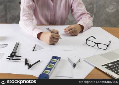 architect working on construction engineering project blueprint