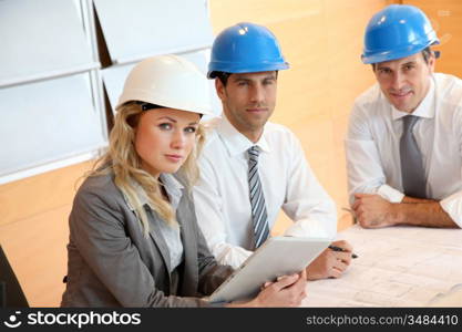 Architects and businesswomen working on construction project