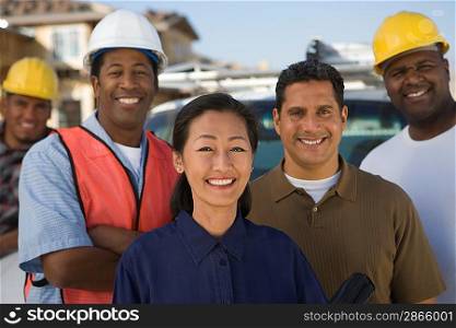 Architects and construction workers on construction site