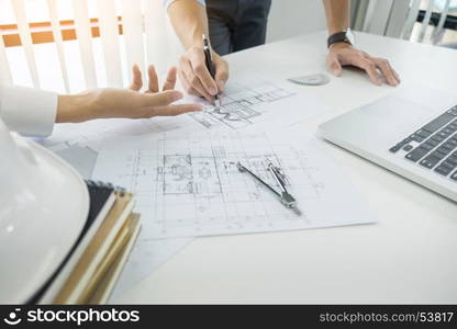 Architects engineer discussing at the table with blueprint - Closeup on hands and project print, Team group on construciton site check documents and business workflow