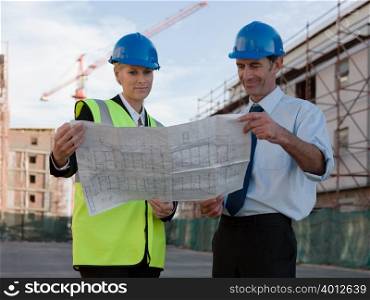 Architects with blueprint