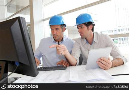 Architects working on construction plan