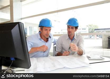 Architects working on construction plan