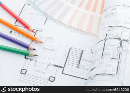 architects workplace - architectural drawings of the modern house with color pencils and sample colors. decoration concept. designer tools.