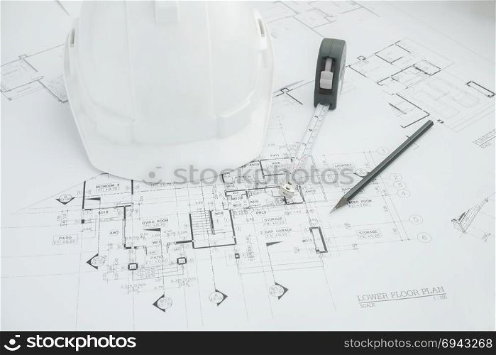Architects workplace - architectural tools, blueprints, helmet, measuring tape, Construction concept. Engineering tools. Top view