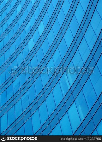 Architectural abstract of glass windows in office building.