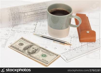 Architectural cad drawing with coffee cup and money